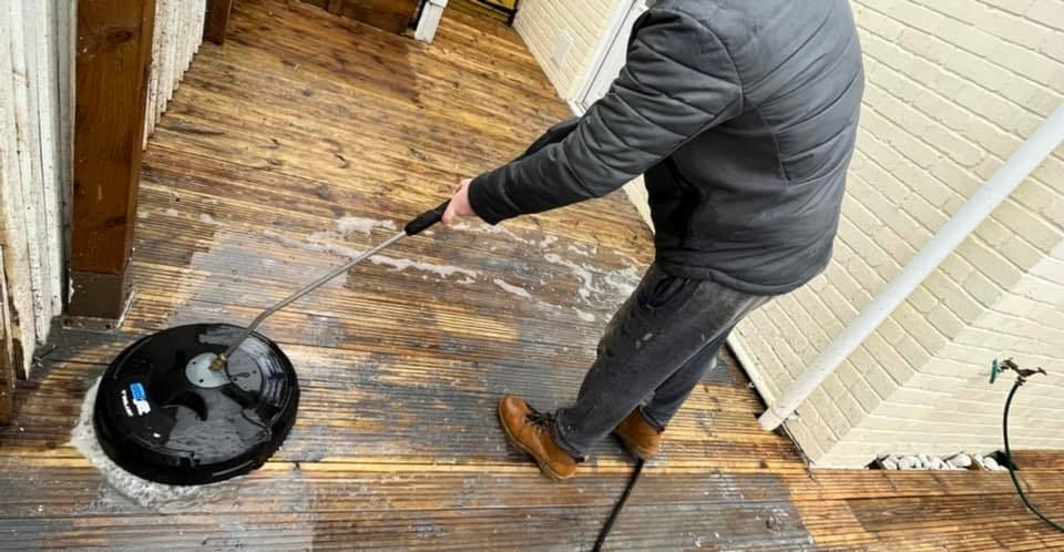 Extreme Exterior Cleaning team member cleaning decking